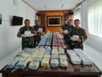personel-tni-ad-menggagalkan-upaya-penyelundupan-narkoba-jenis-sabu-dan-pil-ekstasi-di-temajuk-kalbar-hampir-36-kg-sabu-disita_169_copy_450x253